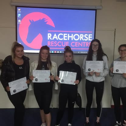 Students receiving Racehorse Rescue Centre placement certificates