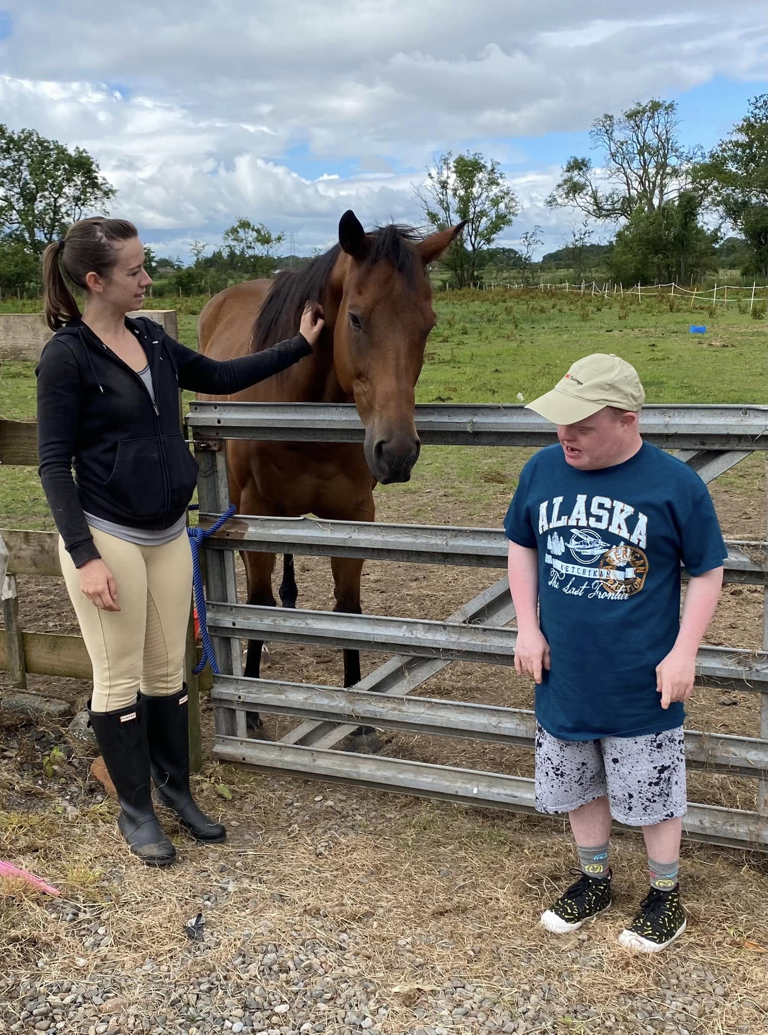 Volunteer and participant with a rescued horse