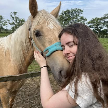 A Racehorse Rescue Centre volunteer with a horse