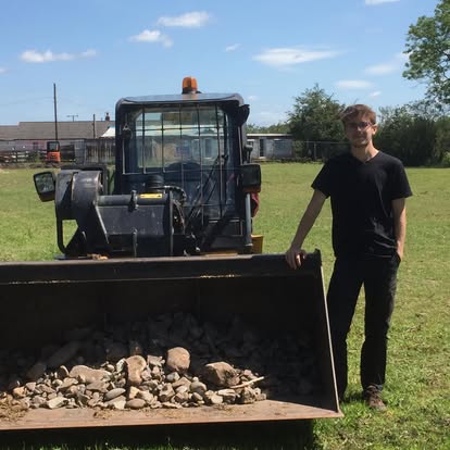 A volunteer supporting practical work at Racehorse Rescue Centre